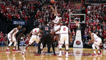 Dec 31, 2016; Indianapolis, IN, USA; Louisville Cardinals square off against the Indiana Hoosiers for the opening jump ball at Bankers Life Fieldhouse. Mandatory Credit: Brian Spurlock-USA TODAY Sports