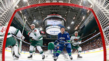 VANCOUVER, BC - MARCH 9: Jonas Brodin #25 and Zach Parise #11 of the Minnesota Wild and Brendan Leipsic #9 of the Vancouver Canucks watch a loose puck during their NHL game at Rogers Arena March 9, 2018 in Vancouver, British Columbia, Canada. (Photo by Jeff Vinnick/NHLI via Getty Images)