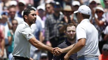 May 12, 2016; Ponte Vedra Beach, FL, USA; Jason Day (left) shakes hands with Jordan Spieth (right) and Branden Grace (middle) after completing the first round of the 2016 Players Championship golf tournament at TPC Sawgrass - Stadium Course. Mandatory Credit: Jason Getz-USA TODAY Sports