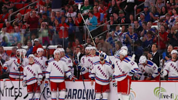Mar 31, 2016; Raleigh, NC, USA; New York Rangers forward Eric Staal (12) raises his stick during a video replay of his career as a Carolina Hurricanes at PNC Arena. The Hurricanes won 4-3. Mandatory Credit: James Guillory-USA TODAY Sports