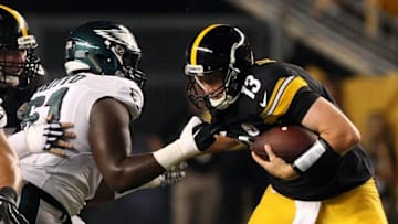 Aug 18, 2016; Pittsburgh, PA, USA; Philadelphia Eagles defensive tackle Aziz Shittu (61) sacks Pittsburgh Steelers quarterback Dustin Vaughan (13) during the second half of their game at Heinz Field. The Eagles won the game, 17-0. Mandatory Credit: Jason Bridge-USA TODAY Sports