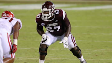 STARKVILLE, MISSISSIPPI - OCTOBER 03: Charles Cross #67 of the Mississippi State Bulldogs in action against the Arkansas Razorbacks during a game at Davis Wade Stadium on October 03, 2020 in Starkville, Mississippi. (Photo by Jonathan Bachman/Getty Images)