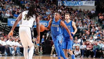 DALLAS, TX - DECEMBER 4: Dennis Smith Jr. #1 of the Dallas Mavericks dribbles the ball against the Denver Nuggets on December 4, 2017 at the American Airlines Center in Dallas, Texas. NOTE TO USER: User expressly acknowledges and agrees that, by downloading and or using this photograph, User is consenting to the terms and conditions of the Getty Images License Agreement. Mandatory Copyright Notice: Copyright 2017 NBAE (Photo by Danny Bollinger/NBAE via Getty Images)