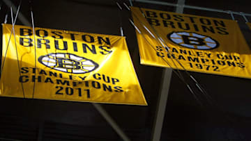BOSTON - OCTOBER 6: The Boston Bruins 2011 Stanley Cup banner rises next to the 1972 banner. (Photo by John Tlumacki/The Boston Globe via Getty Images)