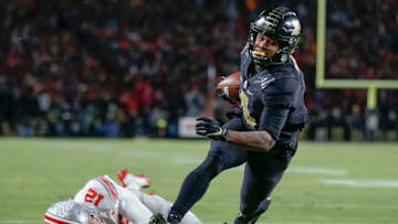 WEST LAFAYETTE, IN - OCTOBER 20: Rondale Moore #4 of the Purdue Boilermakers runs into the end zone for a touchdown during the second quarter as Sevyn Banks #12 of the Ohio State Buckeyes falls at Ross-Ade Stadium on October 20, 2018 in West Lafayette, Indiana. (Photo by Michael Hickey/Getty Images)