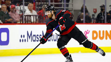 RALEIGH, NORTH CAROLINA - JUNE 08: Dougie Hamilton #19 of the Carolina Hurricanes skates with the puck during the first period in Game Five of the Second Round of the 2021 Stanley Cup Playoffs against the Tampa Bay Lightning at PNC Arena on June 08, 2021 in Raleigh, North Carolina. (Photo by Jared C. Tilton/Getty Images)