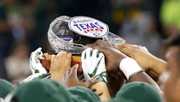 HOUSTON, TX - DECEMBER 27: Baylor Bears hoist the championship trophy as they defeat the Vanderbilt Commodores 48-35 during the Academy Sports + Outdoors Texas Bowl at NRG Stadium on December 27, 2018 in Houston, Texas. (Photo by Bob Levey/Getty Images)