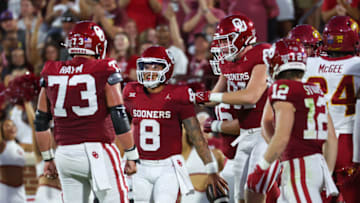 Sep 30, 2023; Norman, Oklahoma, USA; Oklahoma Sooners quarterback Dillon Gabriel (8) celebrates with teammates after scoring a touchdown during the first half against the Iowa State Cyclones at Gaylord Family-Oklahoma Memorial Stadium. Mandatory Credit: Kevin Jairaj-USA TODAY Sports