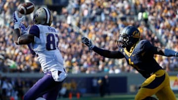 BERKELEY, CA - OCTOBER 11: Tightend Joshua Perkins #82 of the Washington Huskies catches a 25-yard touchdown pass as safety Avery Sebastian #4 of the California Golden Bears defends during the first quarter of their game on October 11, 2014 at California Memorial Stadium in Berkeley, California. (Photo by Stephen Lam/Getty Images)