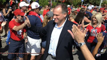 Oct 10, 2015; Tucson, AZ, USA; Arizona Wildcats head coach Rich Rodriguez high fives fans during the wildcat walk before the game against the Oregon State Beavers at Arizona Stadium. Mandatory Credit: Casey Sapio-USA TODAY Sports