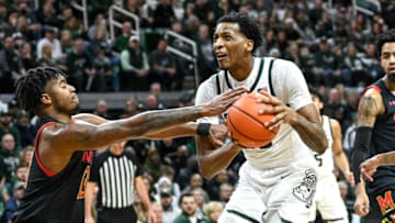 Michigan State's Marcus Bingham Jr., right, is fouled by Maryland's Hakim Hart during the first half on Saturday, March 6, 2022, at the Breslin Center.220306 Msu Maryland 116a