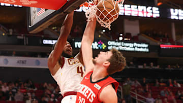 Feb 2, 2022; Houston, Texas, USA; Cleveland Cavaliers center Evan Mobley (4) dunks against Houston Rockets center Alperen Sengun (28) in the second half at Toyota Center. Mandatory Credit: Thomas Shea-USA TODAY Sports
