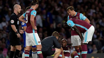 LONDON, ENGLAND - AUGUST 15: Andre Ayew of West Ham United is down injured during the Premier League match between Chelsea and West Ham United at Stamford Bridge on August 15, 2016 in London, England. (Photo by Arfa Griffiths/West Ham United via Getty Images)