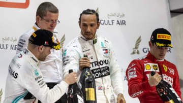 BAHRAIN, BAHRAIN - MARCH 31: Top three finishers Lewis Hamilton of Great Britain and Mercedes GP, Valtteri Bottas of Finland and Mercedes GP and Charles Leclerc of Monaco and Ferrari celebrate on the podium during the F1 Grand Prix of Bahrain at Bahrain International Circuit on March 31, 2019 in Bahrain, Bahrain. (Photo by Lars Baron/Getty Images)