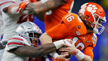 Ohio State Buckeyes defensive end Tyreke Smith (11) tackles Clemson Tigers quarterback Trevor Lawrence (16) on a run in the third quarter during the College Football Playoff semifinal at the Allstate Sugar Bowl in the Mercedes-Benz Superdome in New Orleans on Friday, Jan. 1, 2021.Xxx Osu20sugar Kwr 38 Jpg Usa La