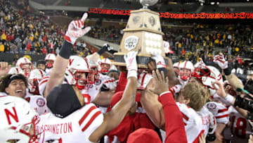 The Nebraska football team celebrate with the Heroes Trophy after the match-up against the Iowa Hawkeyes at Kinnick Stadium(Photo by Matthew Holst/Getty Images)