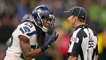 Oct 30, 2016; New Orleans, LA, USA; Seattle Seahawks cornerback Richard Sherman (25) talks to side judge Alex Kemp (55) in the second half against the New Orleans Saints at the Mercedes-Benz Superdome. The Saints won, 25-20. Mandatory Credit: Chuck Cook-USA TODAY Sports