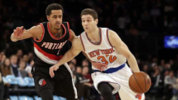 Mar 1, 2016; New York, NY, USA; New York Knicks guard Jimmer Fredette (32) drives to the basket past Portland Trail Blazers guard Brian Roberts (2) during the second half at Madison Square Garden. The Trail Blazers defeated the Knicks 104-85. Mandatory Credit: Adam Hunger-USA TODAY Sports