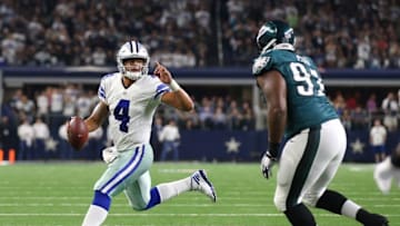 Oct 30, 2016; Arlington, TX, USA; Dallas Cowboys quarterback Dak Prescott (4) scrambles against Philadelphia Eagles defensive tackle Fletcher Cox (91) at AT&T Stadium. Mandatory Credit: Matthew Emmons-USA TODAY Sports