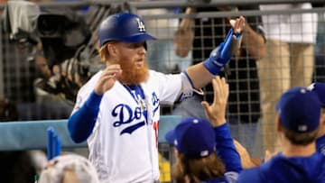LOS ANGELES, CA - AUGUST 20: Justin Turner #10 of the Los Angeles Dodgers is congratulated in the dugout after scoring during the fifth inning of a game against the St. Louis Cardinals at Dodger Stadium on August 20, 2018 in Los Angeles, California. (Photo by Sean M. Haffey/Getty Images)
