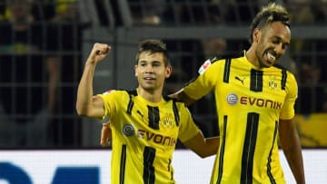 Dortmund's Raphael Guerreiro, left, celebrates his goal with scorer Pierre-Emerick Aubameyang, right, during the German Bundesliga soccer match between Borussia Dortmund and SC Freiburg in Dortmund, Germany, Friday, Sept. 23, 2016. Dortmund defeated Freiburg 3-1. (AP Photo/Martin Meissner)