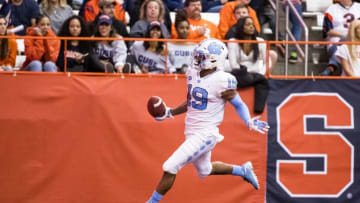 SYRACUSE, NY - OCTOBER 20: Dazz Newsome #19 of the North Carolina Tar Heels returns a punt for a touchdown during the third quarter against the Syracuse Orange at the Carrier Dome on October 20, 2018 in Syracuse, New York. Syracuse defeats North Carolina in overtime 40-37. (Photo by Brett Carlsen/Getty Images)