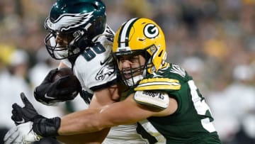 GREEN BAY, WISCONSIN - SEPTEMBER 26: Blake Martinez #50 of the Green Bay Packers tackles Dallas Goedert #88 of the Philadelphia Eagles in the third quarter at Lambeau Field on September 26, 2019 in Green Bay, Wisconsin. (Photo by Quinn Harris/Getty Images)