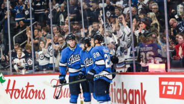 Winnipeg Jets forward Jansen Harkins (58), Patrik Laine (29), Jack Roslovic (28) Mandatory Credit: Terrence Lee-USA TODAY Sports