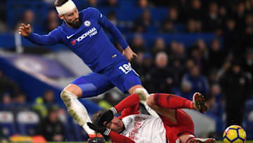 LONDON, ENGLAND - FEBRUARY 12: Olivier Giroud of Chelsea is challenged by Grzegorz Krychowiak of West Bromwich Albion during the Premier League match between Chelsea and West Bromwich Albion at Stamford Bridge on February 12, 2018 in London, England. (Photo by Mike Hewitt/Getty Images)