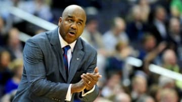 Jan 20, 2014; Washington, DC, USA; Georgetown Hoyas head coach John Thompson III (left) talks to his players in the first half against the Marquette Golden Eagles at Verizon Center. Mandatory Credit: Evan Habeeb-USA TODAY Sports