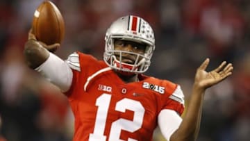 Jan 12, 2015; Arlington, TX, USA; Ohio State Buckeyes quarterback Cardale Jones (12) warms up before the game against the Oregon Ducks in the 2015 CFP National Championship Game at AT&T Stadium. Mandatory Credit: Tim Heitman-USA TODAY Sports