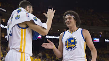 May 18, 2016; Oakland, CA, USA; Golden State Warriors forward Anderson Varejao (18) is congratulated by center Andrew Bogut (12) against the Oklahoma City Thunder during the fourth quarter in game two of the Western conference finals of the NBA Playoffs at Oracle Arena. The Warriors defeated the Thunder 118-91. Mandatory Credit: Kyle Terada-USA TODAY Sports