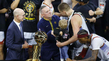 Head coach Michael Malone of the Denver Nuggets and Nikola Jokic #15 celebrate after a 94-89 victory against the Miami Heat in Game Five of the 2023 NBA Finals to win the NBA Championship (Photo by Justin Edmonds/Getty Images)