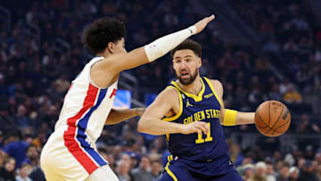 Klay Thompson #11 of the Golden State Warriors is guarded by Killian Hayes #7 of the Detroit Pistons (Photo by Ezra Shaw/Getty Images)