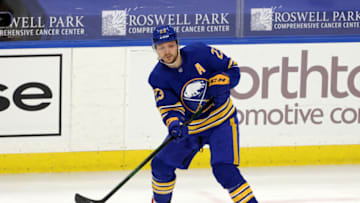 Apr 18, 2021; Buffalo, New York, USA; Buffalo Sabres center Sam Reinhart (23) makes a pass against the Pittsburgh Penguins during the third period at KeyBank Center. Mandatory Credit: Timothy T. Ludwig-USA TODAY Sports