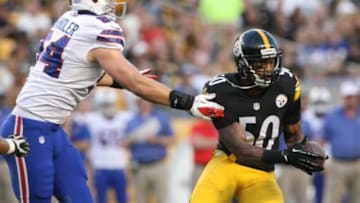 Aug 16, 2014; Pittsburgh, PA, USA; Pittsburgh Steelers linebacker Ryan Shazier (50) intercepts a pass in front of Buffalo Bills tight end Scott Chandler (84) during the first half at Heinz Field. Mandatory Credit: Jason Bridge-USA TODAY Sports