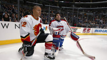 1 Feb 2002: Jarome Iginla of the Calgary Flames and Jose Theodore of the Montreal Canadiens chat during the Dodge NHL SuperSkills competition at the Staples Center in Los Angeles, California. The World defeated North America 21-11. DIGITAL IMAGE. Mandatory Credit: Robert LaBerge/Getty Images/NHLI