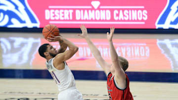 Dec 5, 2020; Tucson, Arizona, USA; Arizona Wildcats guard Terrell Brown (31) shoots over Eastern Washington Eagles guard Tyler Robertson (15) during the first half at McKale Center. Mandatory Credit: Joe Camporeale-USA TODAY Sports
