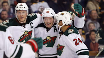 Oct 25, 2016; Boston, MA, USA; Minnesota Wild defenseman Ryan Suter (20) celebrates his goal with center Mikko Koivu (9) and defenseman Matt Dumba (24) during the second period against Boston Bruins at TD Garden. Mandatory Credit: Winslow Townson-USA TODAY Sports