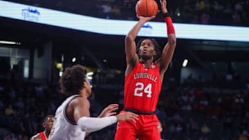 Feb 25, 2023; Atlanta, Georgia, USA; Louisville Cardinals forward Jae'Lyn Withers (24) shoots over Georgia Tech Yellow Jackets forward Javon Franklin (4) in the first half at McCamish Pavilion. Mandatory Credit: Brett Davis-USA TODAY Sports