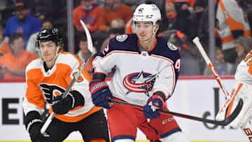 Jan 20, 2022; Philadelphia, Pennsylvania, USA; Columbus Blue Jackets center Alexandre Texier (42) battles for position with Philadelphia Flyers defenseman Travis Sanheim (6) during the first period at Wells Fargo Center. Mandatory Credit: Eric Hartline-USA TODAY Sports