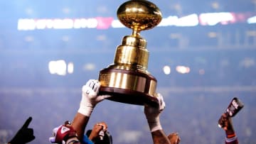 STARKVILLE, MS - NOVEMBER 28: Members of the Mississippi State Bulldogs hold the "Golden Egg" trophy following a victory over the Ole Miss Rebels at Davis Wade Stadium on November 28, 2013 in Starkville, Mississippi. Mississippi State won the game 17-10. (Photo by Stacy Revere/Getty Images)