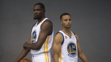 September 26, 2016; Oakland, CA, USA; Golden State Warriors forward Kevin Durant (35) and guard Stephen Curry (30) pose for a photo during media day at the Warriors Practice Facility. Mandatory Credit: Kyle Terada-USA TODAY Sports