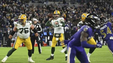 Dec 19, 2021; Baltimore, Maryland, USA; Green Bay Packers quarterback Aaron Rodgers (12) throws to wide receiver Davante Adams (not pictured) for a second quarter touchdown against the Baltimore Ravens at M&T Bank Stadium. Mandatory Credit: Tommy Gilligan-USA TODAY Sports