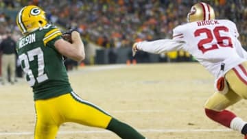 Jan 5, 2014; Green Bay, WI, USA; Green Bay Packers wide receiver Jordy Nelson (87) catches a touchdown pass as San Francisco 49ers cornerback Tramaine Brock (26) defends during the second quarter of the 2013 NFC wild card playoff football game at Lambeau Field. Mandatory Credit: Jeff Hanisch-USA TODAY Sports