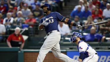Sep 27, 2016; Arlington, TX, USA; Milwaukee Brewers first baseman Chris Carter (33) watches his two run home run in the first inning against the Texas Rangers at Globe Life Park in Arlington. Mandatory Credit: Tim Heitman-USA TODAY Sports