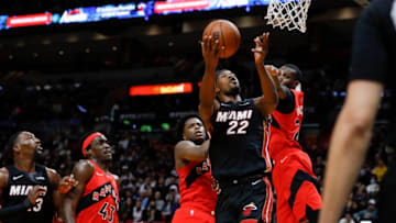 Miami Heat forward Jimmy Butler (22) scores a layup shot over Toronto Raptors center Khem Birch (24) and forward OG Anunoby (3)(Sam Navarro-USA TODAY Sports)