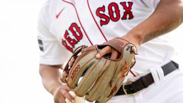 FORT MYERS, FL - FEBRUARY 21: A view of the glove of Rafael Devers #11 of the Boston Red Sox as he throws during a Spring Training team workout on February 21, 2023 at JetBlue Park at Fenway South in Fort Myers, Florida. (Photo by Maddie Malhotra/Boston Red Sox/Getty Images)