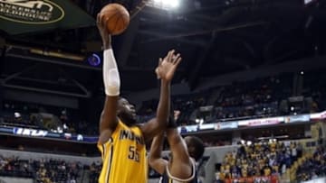 Nov 10, 2014; Indianapolis, IN, USA; Indiana Pacers center Roy Hibbert (55) takes a shot against Utah Jazz forward Derrick Favors (15) at Bankers Life Fieldhouse. Indiana defeats Utah 97-86. Mandatory Credit: Brian Spurlock-USA TODAY Sports
