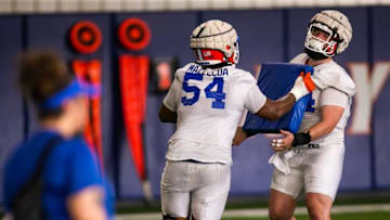 Florida Gators offensive lineman Micah Mazzccua (54) drives back Florida Gators offensive lineman Riley Simonds (64) during a blocking drill. The University of Florida Football team held their 2023 Football Spring Practice Tuesday afternoon, March 7, 2023 at Sanders Football Practice Field at the University of Florida in Gainesville, FL. [Doug Engle/Ocala Star Banner]2023 tGai Uffootballspring2